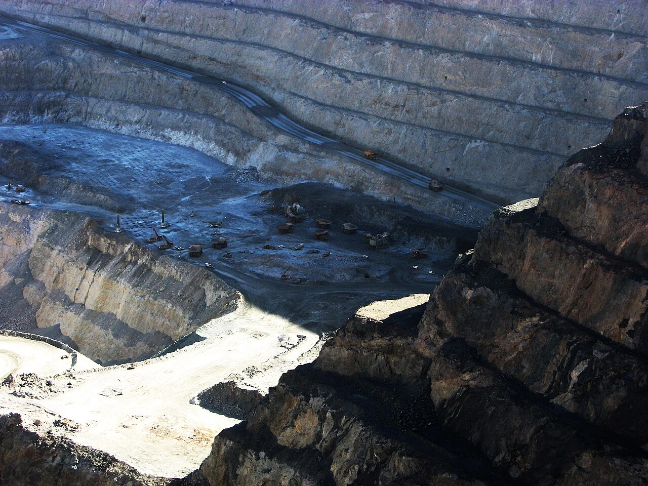 Benched walls and haul trucks inside the Super Pit gold mine in Kalgoorlie.